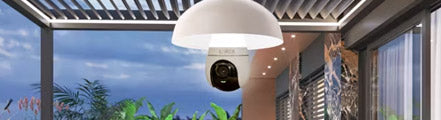 Lorex 2K Wi-Fi lightbulb security camera mounted in a white ceiling fixture on a covered patio, blending lighting and smart surveillance for outdoor home protection.