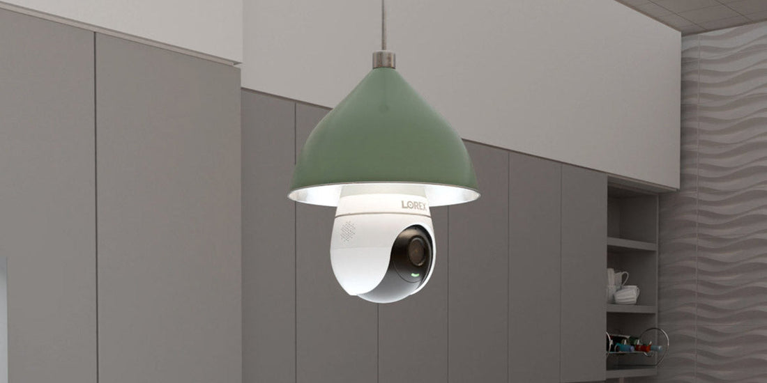 Lorex 2K lightbulb security camera installed in a pendant light fixture within a modern kitchen