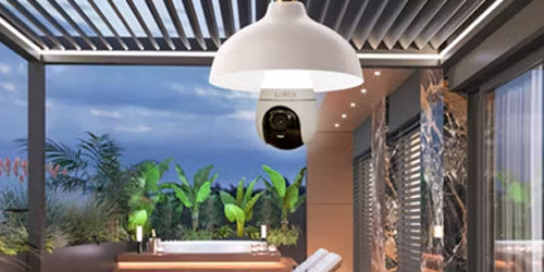 Lorex 2K Wi-Fi lightbulb security camera mounted in a white ceiling fixture on a covered patio, blending lighting and smart surveillance for outdoor home protection.