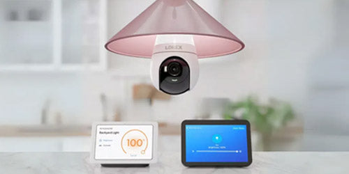 Lorex 2K Wi-Fi lightbulb security camera installed in a pink indoor ceiling fixture, offering smart surveillance and modern design for home monitoring.